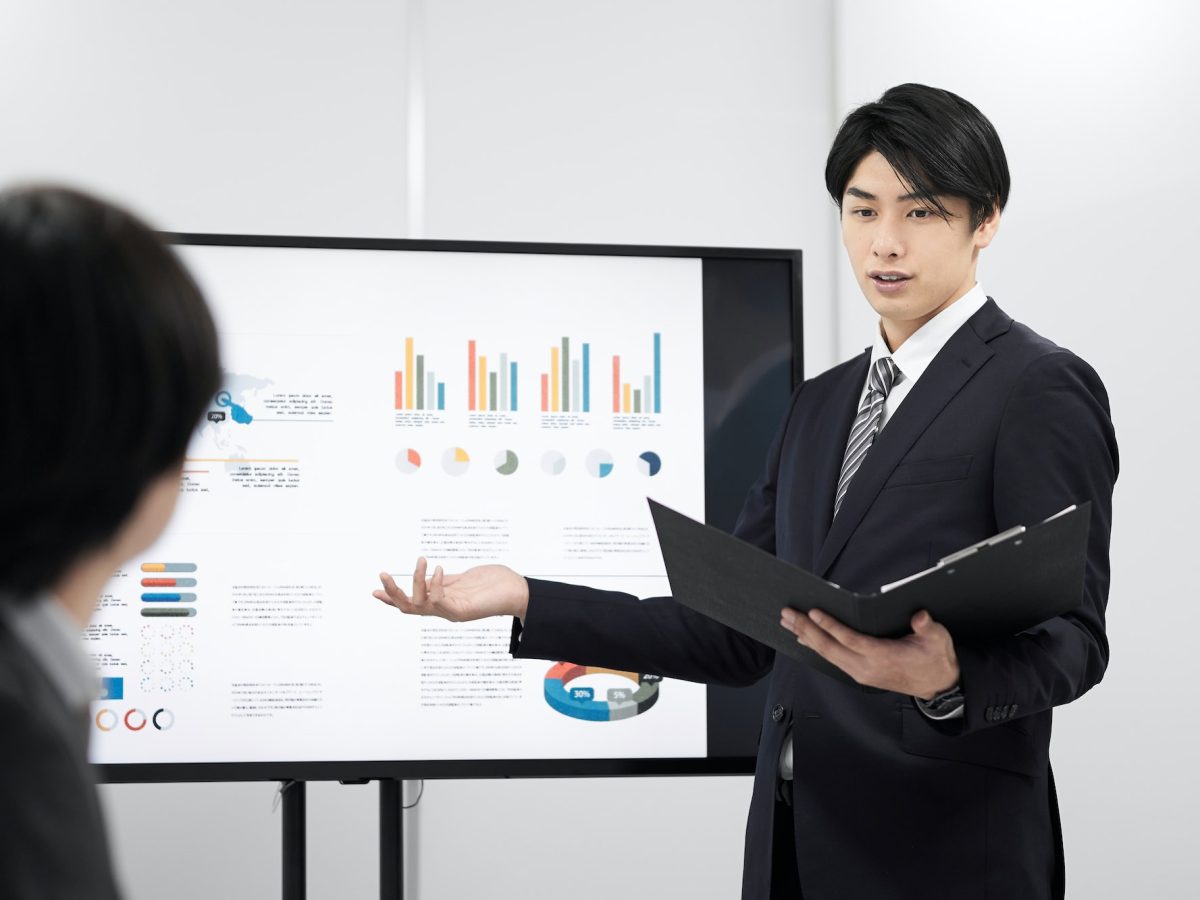 a-japanese-male-businessman-giving-a-presentation-.jpg a-japanese-male-businessman-giving-a-presentation-.jpg